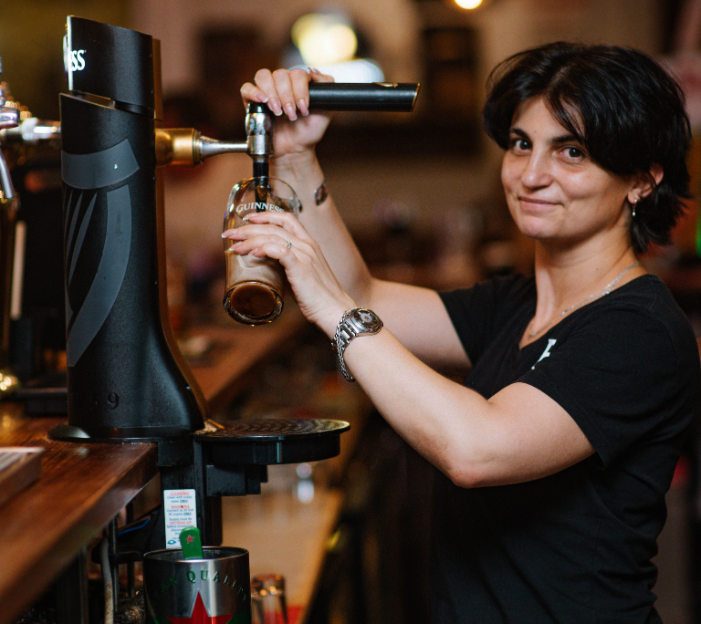 Guinness Certified Bartender is pouring the Guinness properly at Brown's Bar Tbilisi